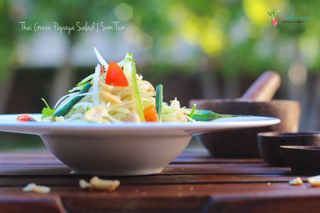 A side shot of Thai green papaya salad
