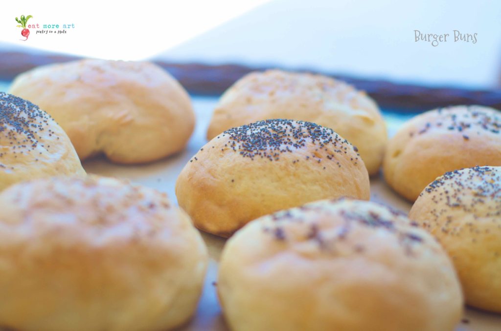 Burger buns topped with poppy seeds and sesame seeds