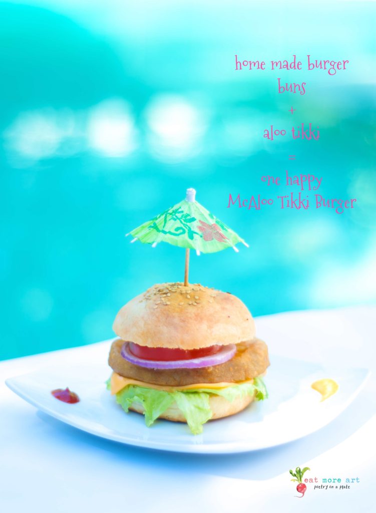 A veggie burger with an umbrella shaped toothpick, by the swimming pool
