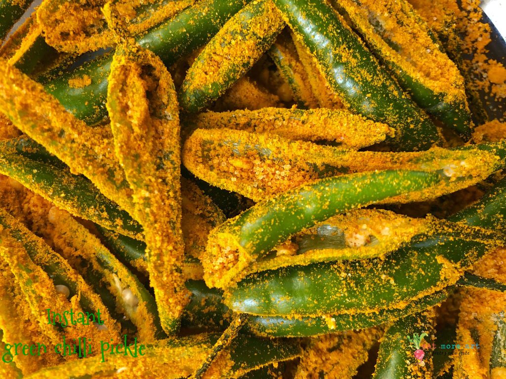 A close up shot of green chillies covered in salt and turmeric