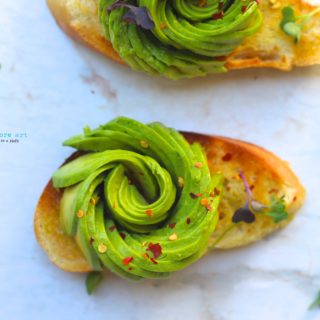 A toast topped with avocado rose